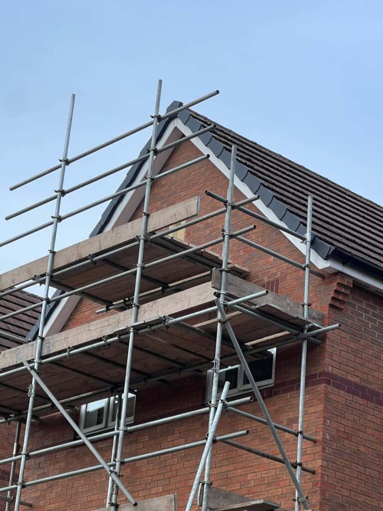 This is a photo of a roof which has just been repaired. There is a scaffold located at the gable end for access onto the roof. Works carried out by MCM Roofing Repairs Verwood
